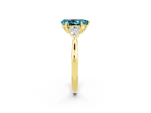 Yellow gold Pear Cut Blue Topaz Three-Stone Ring with Pear  Side Stones and Prong Setting