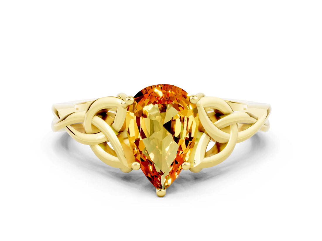 Yellow gold Pear Cut Citrine Solitaire Engagement Ring with Celtic Knot Band and Four-Prong Setting