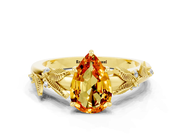 Yellow gold Pear Cut Citrine Solitaire Ring with Leaf Motif Band and Four-Prong Setting