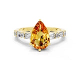 Yellow gold Pear Cut Citrine Solitaire with Side Baguettes and Channel Set Band