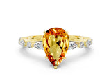 Yellow gold Pear Cut Citrine Solitaire with Side Stones on a Pavé Band and Four-Prong Setting