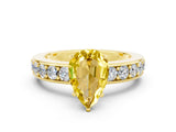 Yellow gold Pear Cut Cut Channel Set Diamond Engagement Ring with Four-Prong Setting