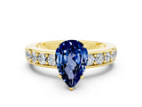 Yellow gold Pear Cut Cut Channel Set Diamond Engagement Ring with Four-Prong Setting