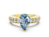 Yellow gold Pear Cut Cut Channel Set Diamond Engagement Ring with Four-Prong Setting
