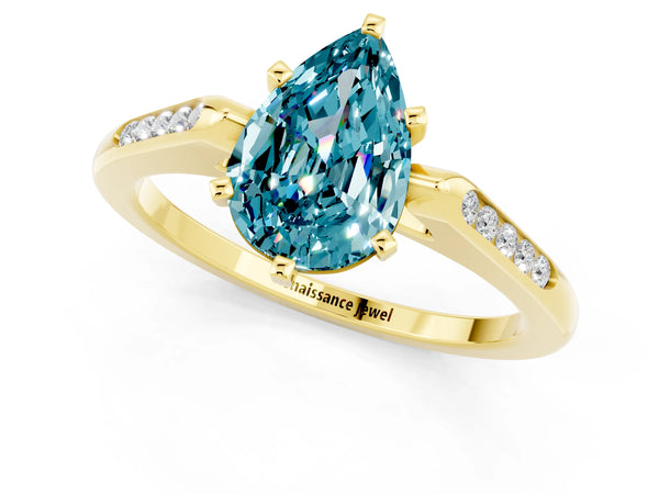 Yellow gold Pear Cut Blue Topaz Solitaire Ring with Channel Set Round Band and Prong Setting