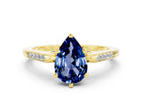 Yellow gold Pear Cut Cut Channel Set Solitaire Engagement Ring with Four-Prong Setting