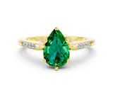 Yellow gold Pear Cut Cut Channel Set Solitaire Engagement Ring with Four-Prong Setting