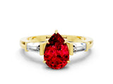 Yellow gold Pear Cut Cut Diamond Ring with Tapered Baguette Side Stones in Four-Prong Setting