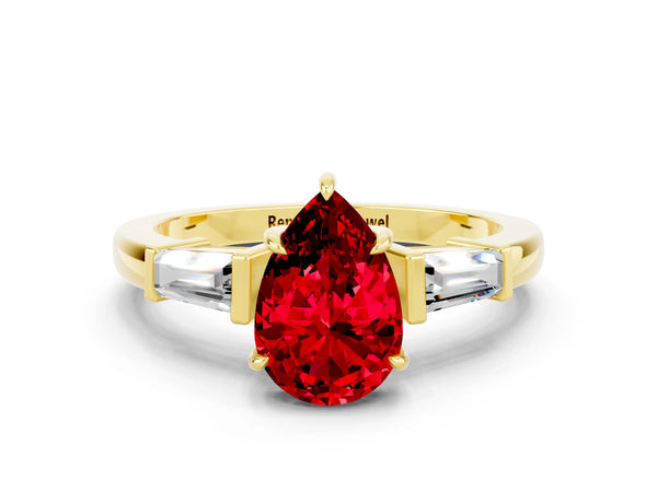 Yellow gold Pear Cut Cut Diamond Ring with Tapered Baguette Side Stones in Four-Prong Setting