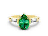 Yellow gold Pear Cut Cut Diamond Ring with Tapered Baguette Side Stones in Four-Prong Setting