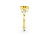 Yellow gold Pear Cut Cut Diamond Ring with Tapered Baguette Side Stones in Four-Prong Setting_2