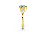 Yellow gold Pear Cut Cut Diamond Ring with Tapered Baguette Side Stones in Four-Prong Setting_2