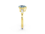 Yellow gold Pear Cut Cut Diamond Ring with Tapered Baguette Side Stones in Four-Prong Setting_2