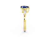 Yellow gold Pear Cut Cut Diamond Ring with Tapered Baguette Side Stones in Four-Prong Setting_2