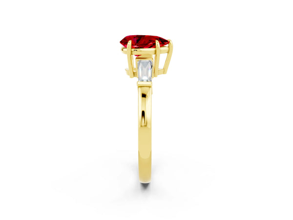 Yellow gold Pear Cut Cut Diamond Ring with Tapered Baguette Side Stones in Four-Prong Setting