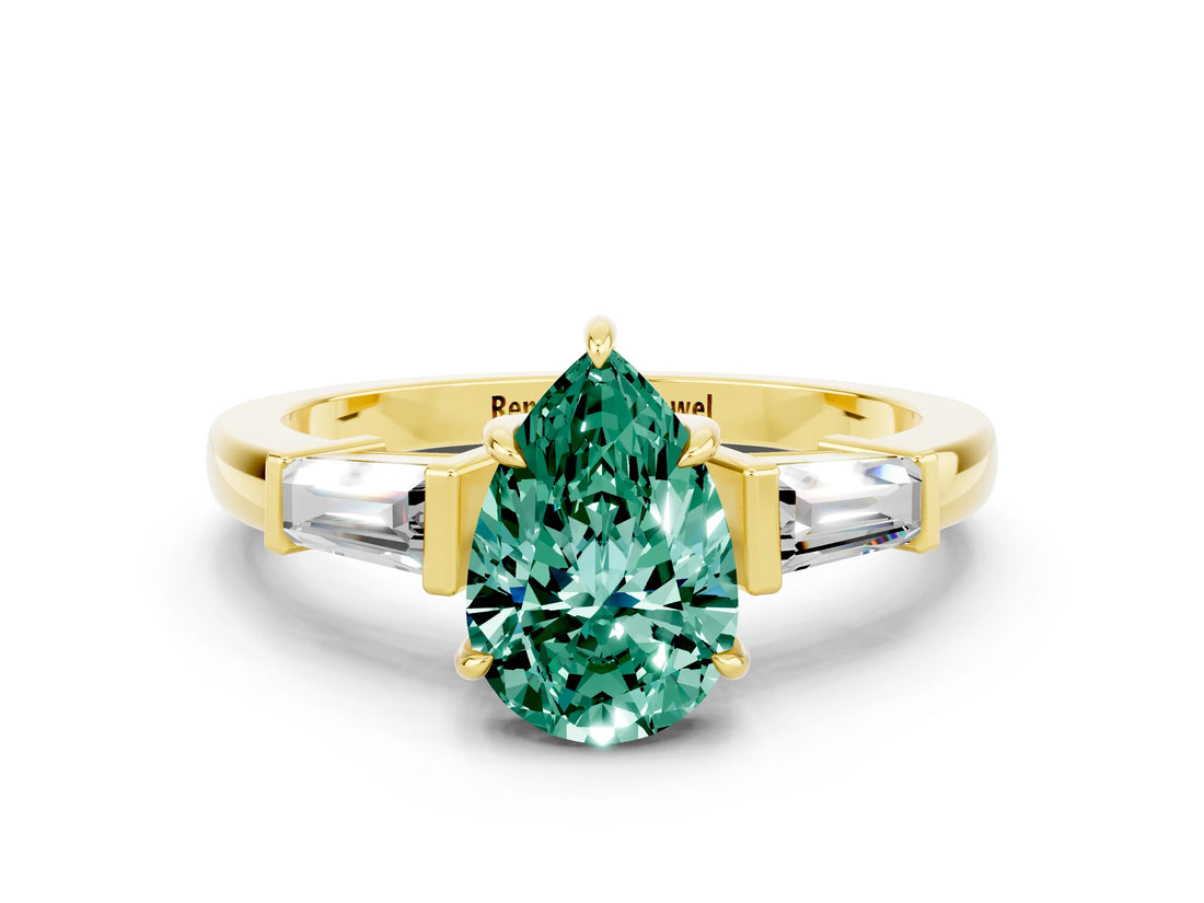 Yellow gold Pear Cut Cut Diamond Ring with Tapered Baguette Side Stones in Four-Prong Setting
