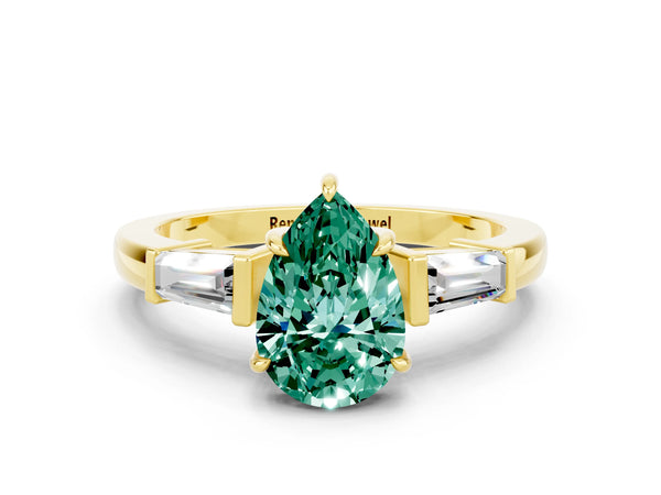 Yellow gold Pear Cut Green Sapphire Three-Stone Ring with Tapered Baguette Side Stones and Prong Setting
