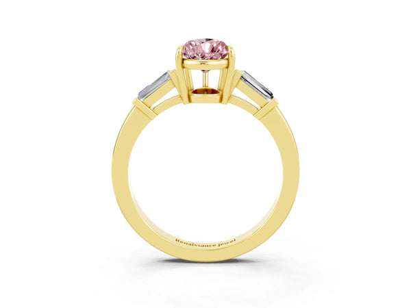 Yellow gold Pear Cut Cut Diamond Ring with Tapered Baguette Side Stones in Four-Prong Setting