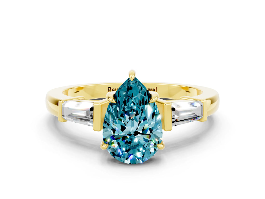 Yellow gold Pear Cut Cut Diamond Ring with Tapered Baguette Side Stones in Four-Prong Setting