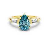 Yellow gold Pear Cut Cut Diamond Ring with Tapered Baguette Side Stones in Four-Prong Setting