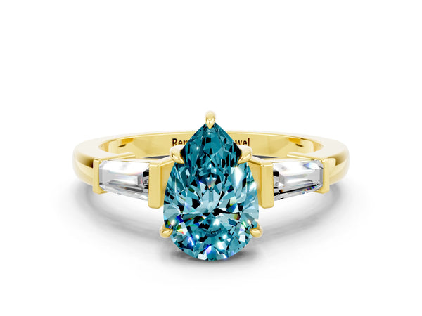 Yellow gold Pear Cut Cut Diamond Ring with Tapered Baguette Side Stones in Four-Prong Setting