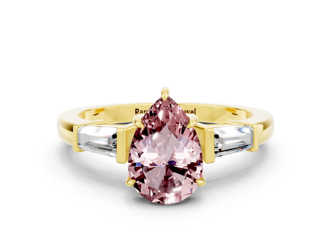 Yellow gold Pear Cut Cut Diamond Ring with Tapered Baguette Side Stones in Four-Prong Setting