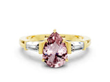 Yellow gold Pear Cut Cut Diamond Ring with Tapered Baguette Side Stones in Four-Prong Setting