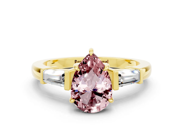 Yellow gold Pear Cut Cut Diamond Ring with Tapered Baguette Side Stones in Four-Prong Setting