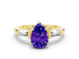 Yellow gold Pear Cut Cut Diamond Ring with Tapered Baguette Side Stones in Four-Prong Setting