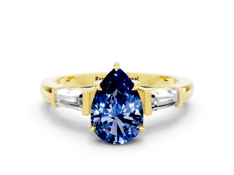 Yellow gold Pear Cut Cut Diamond Ring with Tapered Baguette Side Stones in Four-Prong Setting
