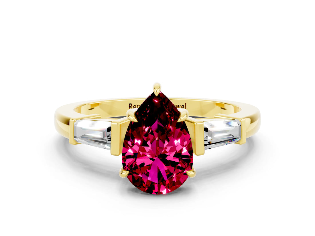 Yellow gold Pear Cut Cut Diamond Ring with Tapered Baguette Side Stones in Four-Prong Setting