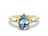 Yellow gold Pear Cut Cut Diamond Ring with Tapered Baguette Side Stones in Four-Prong Setting