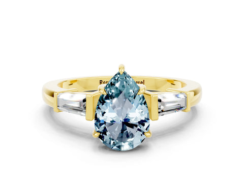Yellow gold Pear Cut Cut Diamond Ring with Tapered Baguette Side Stones in Four-Prong Setting