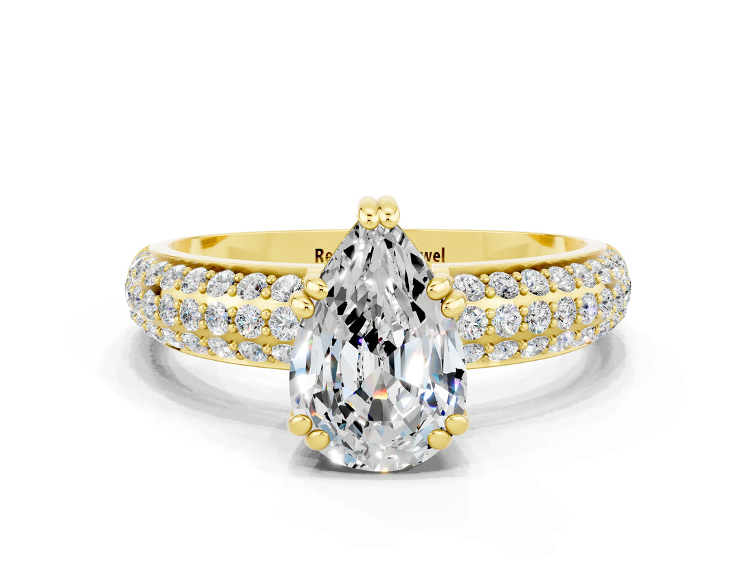 Yellow gold Pear Cut Cut Pave Diamond Engagement Ring with Channel Set Band and Four-Prong Setting
