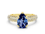 Yellow gold Pear Cut Cut Pave Diamond Engagement Ring with Channel Set Band and Four-Prong Setting