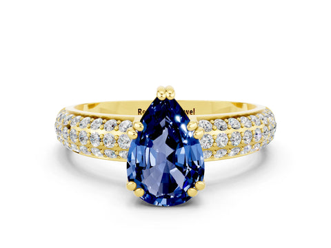 Yellow gold Pear Cut Cut Pave Diamond Engagement Ring with Channel Set Band and Four-Prong Setting