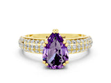 Yellow gold Pear Cut Cut Pave Diamond Engagement Ring with Channel Set Band and Four-Prong Setting