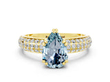 Yellow gold Pear Cut Cut Pave Diamond Engagement Ring with Channel Set Band and Four-Prong Setting