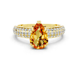 Yellow gold Pear Cut Cut Pave Diamond Engagement Ring with Channel Set Band and Four-Prong Setting