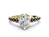 Yellow gold Pear Cut Diamond Cathedral Solitaire Ring with Round with Blue Sapphire side stone Pavé Band_12