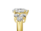 Yellow gold Pear Cut Diamond Cluster Ring with Round Accent Stones and Prong Setting on a Classic Band_65