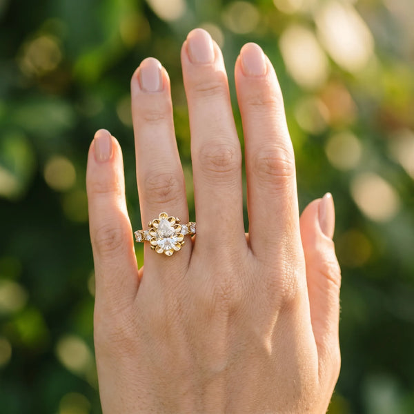 Yellow gold Pear Cut Diamond Floral Halo Engagement Ring with Shared Prong Setting