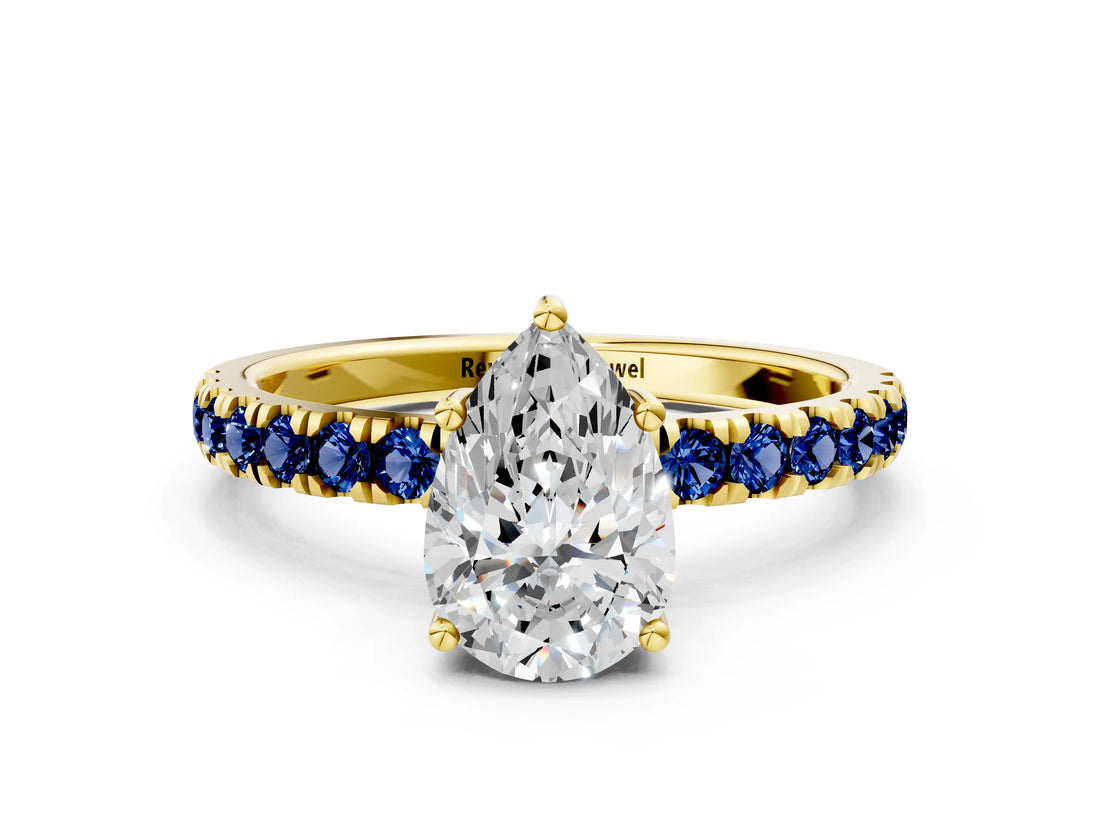 Yellow gold Pear Cut Diamond Pave Band Solitaire Ring with Round with Blue Sapphire side stone and Prong Setting_24