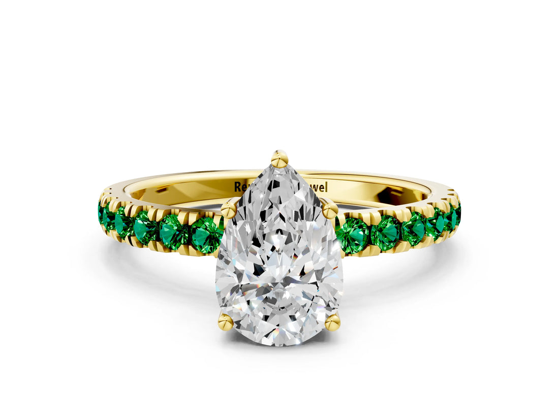 Yellow gold Pear Cut Diamond Pave Band Solitaire Ring with Round with Emerald side stone and Prong Setting