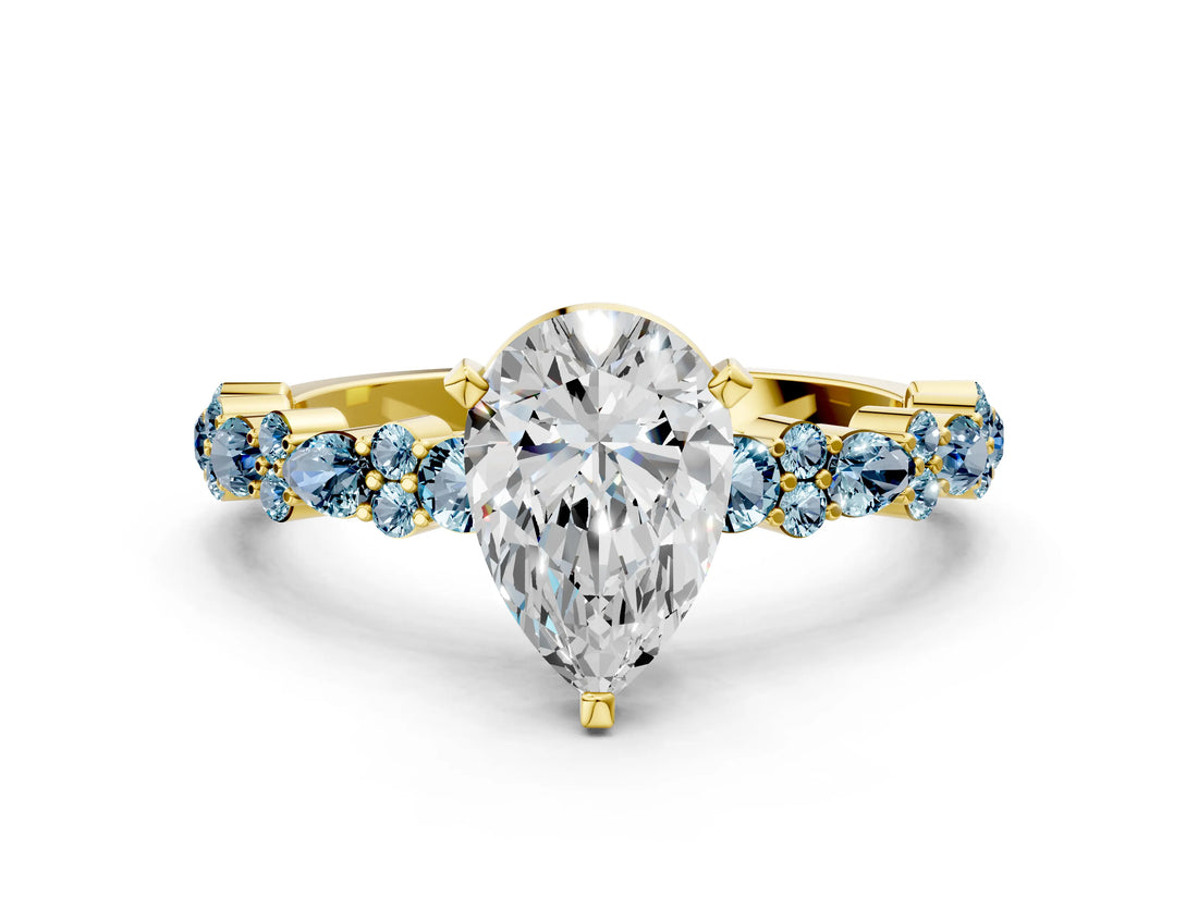 Yellow gold Pear Cut Diamond Side Stone Solitaire Ring with Round with Aquamarine side stone and Four-Prong Setting
