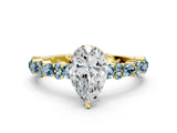 Yellow gold Pear Cut Diamond Side Stone Solitaire Ring with Round with Aquamarine side stone and Four-Prong Setting