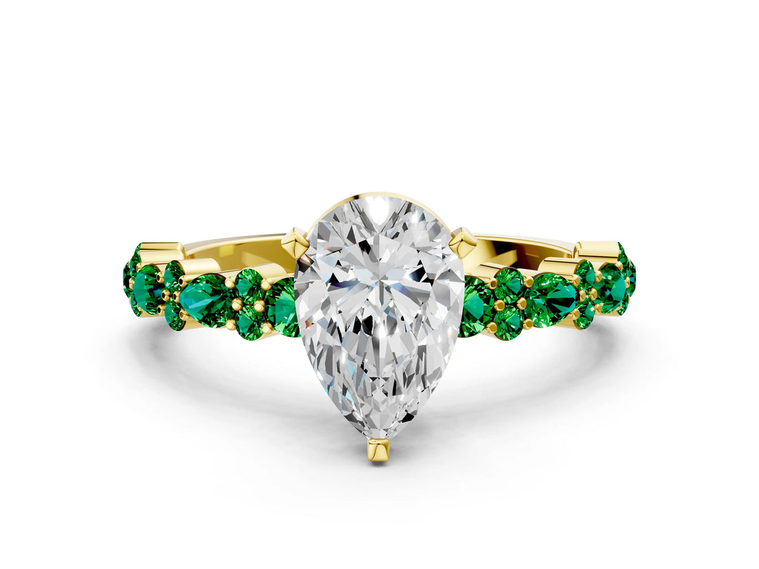 Yellow gold Pear Cut Diamond Side Stone Solitaire Ring with Round with Emerald side stone and Four-Prong Setting
