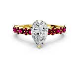 Yellow gold Pear Cut Diamond Side Stone Solitaire Ring with Round with Garnet side stone and Four-Prong Setting