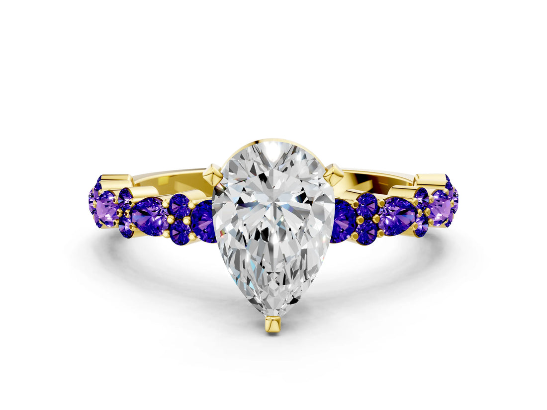Yellow gold Pear Cut Diamond Side Stone Solitaire Ring with Round with Tanzanite side stone and Four-Prong Setting