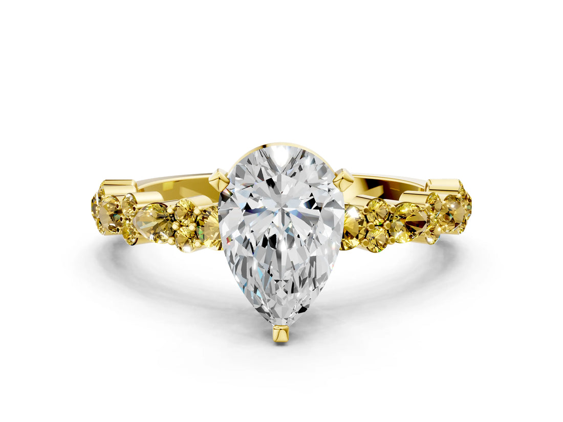 Yellow gold Pear Cut Diamond Side Stone Solitaire Ring with Round with Yellow Sapphire side stone and Four-Prong Setting